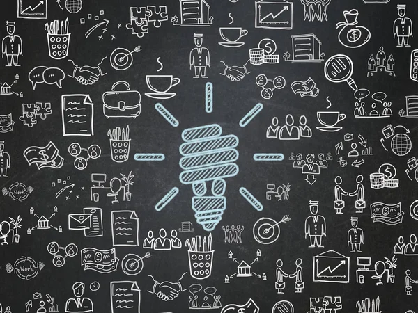 Bedrijfsconcept: Energiebesparende lamp op schoolbord achtergrond — Stockfoto