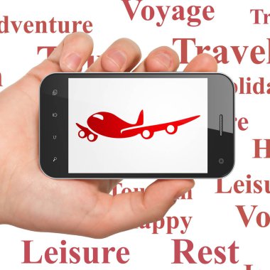 Turizm kavramı: el Smartphone ile ekranda uçak Holding