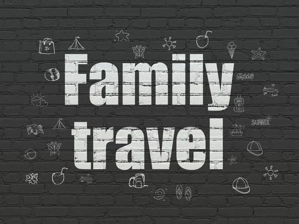 Tourism concept: Family Travel on wall background