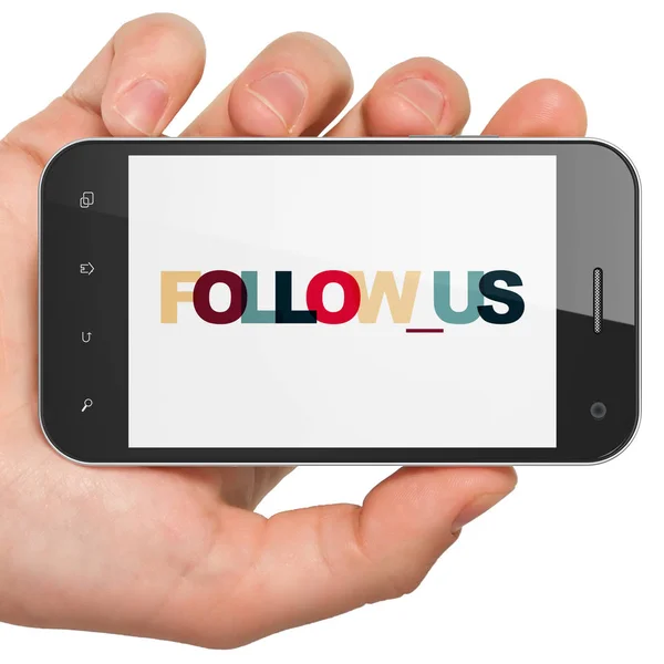 Concetto di social network: Smartphone a mano con Follow us in mostra — Foto Stock