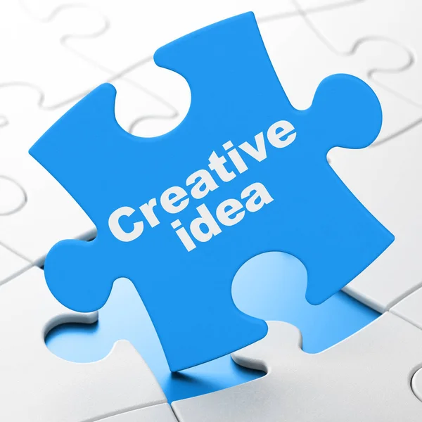 Bedrijfsconcept: creatief idee op puzzel achtergrond — Stockfoto