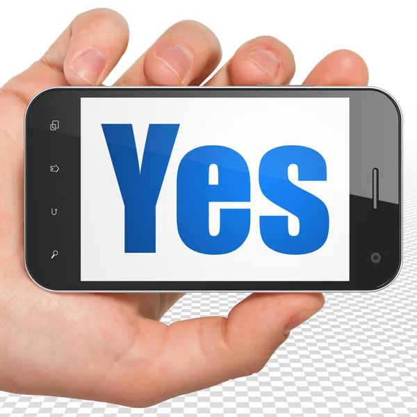 Business concept: Hand Holding Smartphone with Yes on display — Stock Photo, Image