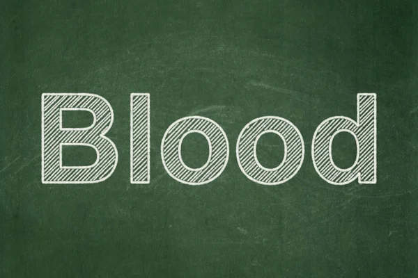 Koncepce zdraví: krev na tabuli pozadí — Stock fotografie