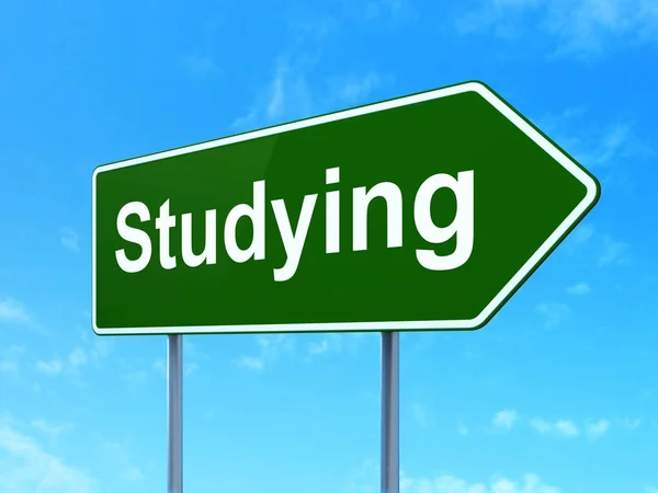 Learning concept: Studying on road sign background — Stock Photo, Image
