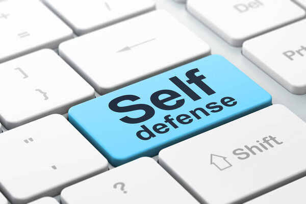 Protection concept: Self Defense on computer keyboard background
