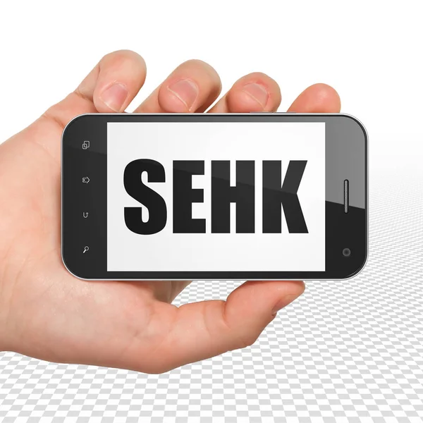 Concepto de índices bursátiles: Smartphone de mano con SEHK en pantalla — Foto de Stock
