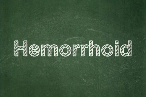 Conceito de saúde: Hemorróide sobre fundo quadro-negro — Fotografia de Stock