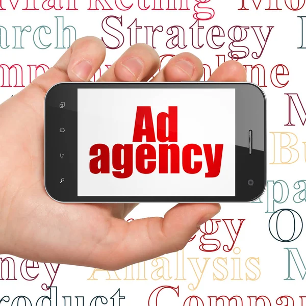 Concepto de marketing: Smartphone de mano con agencia de anuncios en pantalla —  Fotos de Stock