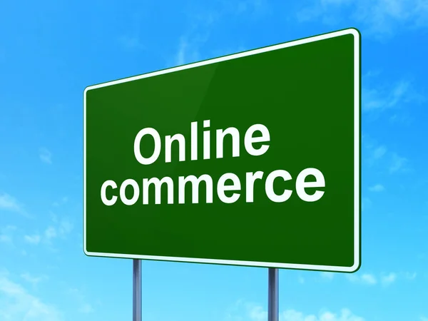 Business concept: Online Commerce on road sign background — Stock Photo, Image