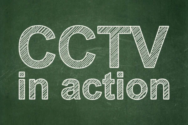 Protection concept: CCTV In action on chalkboard background — Stock Photo, Image