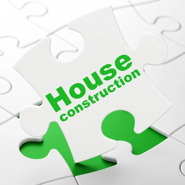 Концепция строительства: Строительство домов на фоне головоломок — стоковое фото