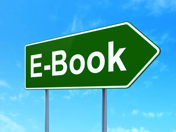 Studying concept: E-Book on road sign background — Stock Photo, Image