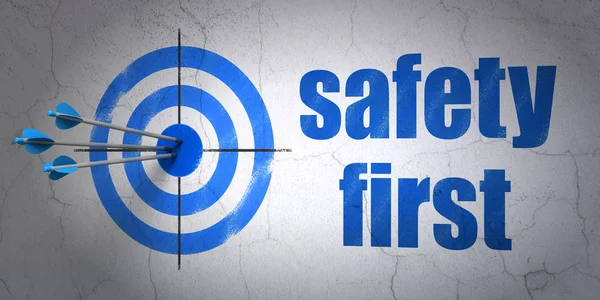 Protection concept: target and Safety First on wall background — Stock Photo, Image