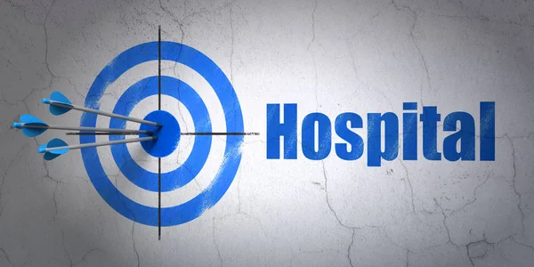 Health concept: target and Hospital on wall background — Stock Photo, Image