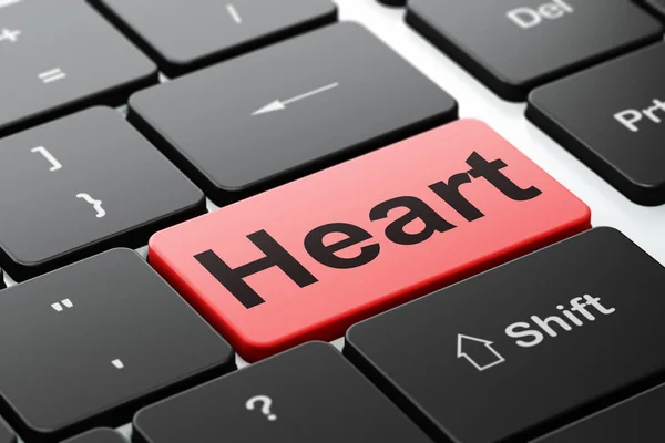 Концепція охорони здоров'я: серце на фоні клавіатури комп'ютера — стокове фото