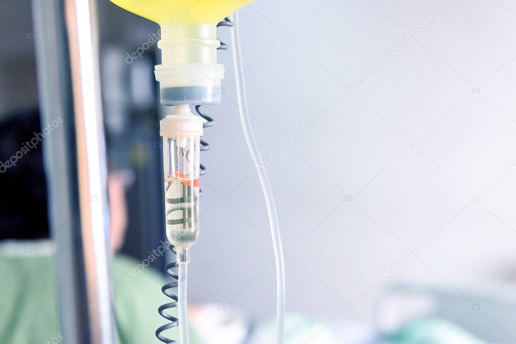 Close up saline solution drip for patient and infusion pump in hospital, Treatment of the disease of the doctor concept.