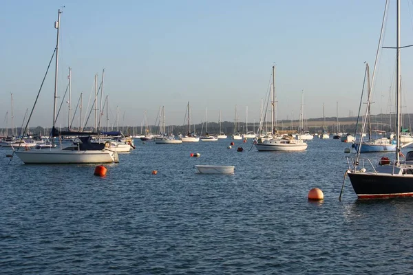 Boats at anchor on a blue clam sea — Stock Photo, Image