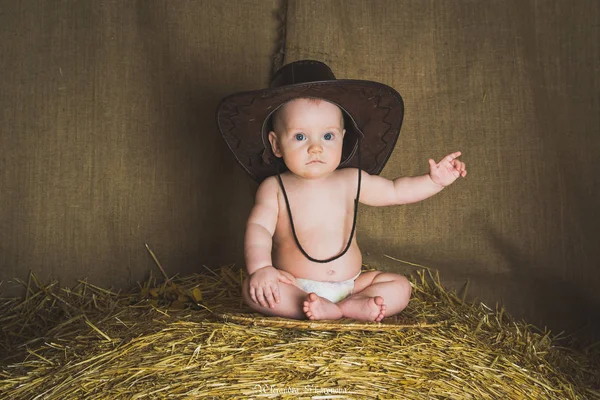 Little boy cowboy in the hay — Stock Photo, Image
