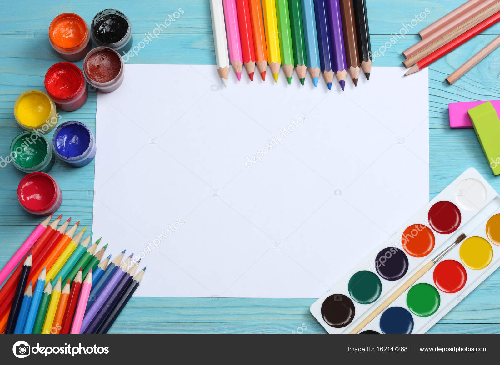 School and office supplies. school background. colored pencils, pen, pains,  paper for school and student education on blue wooden background. top view  Stock Photo by ©muslimova_tv@mail.ru 162147268