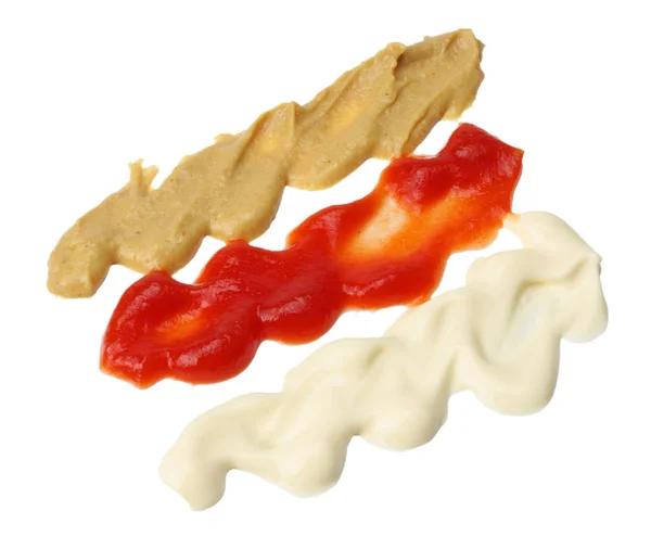 Ketchup-Mayonnaise und Senf wogen, spritzten. isoliert auf weiß — Stockfoto