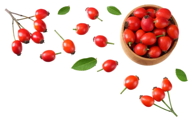 Rosehip berries with green leaves isolated on white background. Top view — Stock Photo, Image