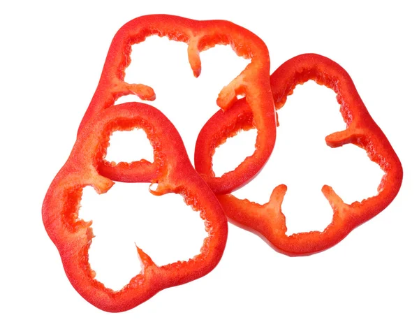 Cut slices of red sweet bell pepper isolated on white background. top view — Stock Photo, Image