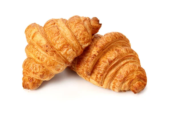 Due croissant freschi isolati su fondo bianco — Foto Stock