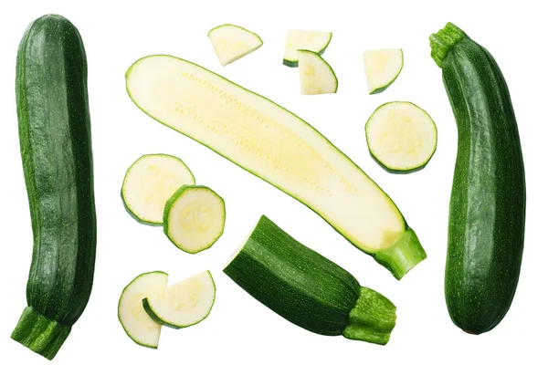 Verse Groene Courgette Met Plakjes Geïsoleerd Witte Achtergrond Bovenaanzicht — Stockfoto