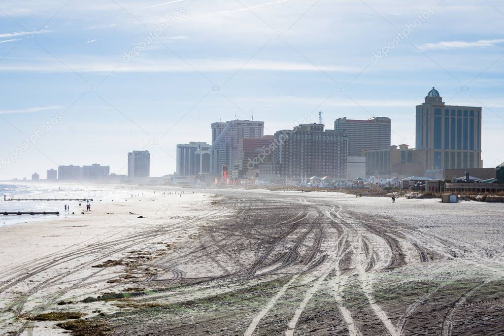 Beach in Atlantic City, New Jersey with boardwalk in background