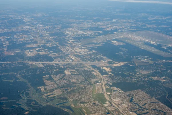 Metropolis Area of Houston, Texas Suburbs from Above in an Airplane