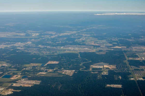 Metropolis Area of Houston, Texas Suburbs from Above in an Airplane