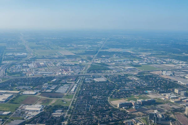 Metropolis Area of Houston, Texas Suburbs from Above in an Airplane