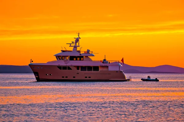 Yacht at golden sunset on open sea — Stock Photo, Image