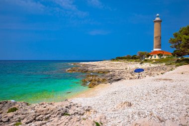 Veli sıçan deniz feneri ve turkuaz beach görüntüleyin