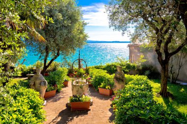 Mediterranean park on Lago di Garda view clipart