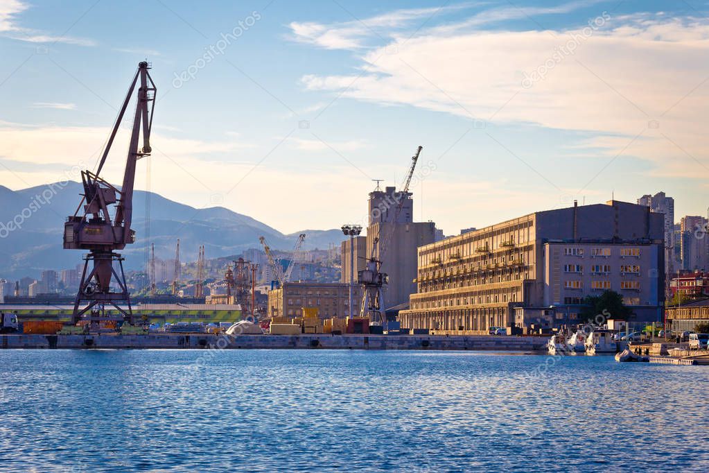 Port city of Rijeka cranes and industrial zone in harbor view