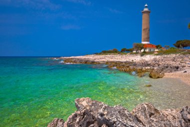 Veli sıçan deniz feneri ve turkuaz beach görüntüleyin