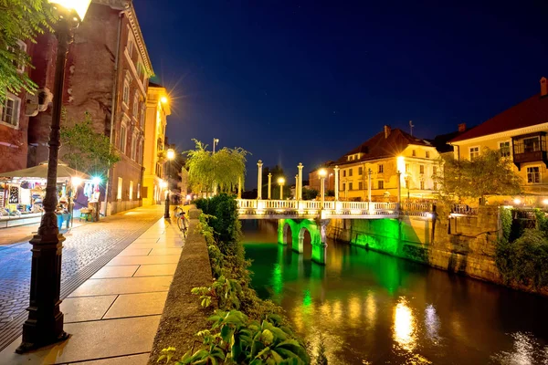 Ljubljanica river waterfront i Ljubljana kväll se — Stockfoto