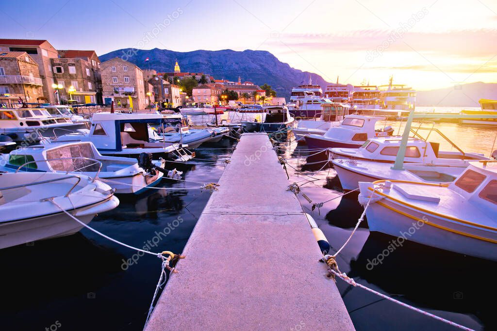 Town of Korcula coastline and harbor colorful sunset view, island in archipelago of southern Croati