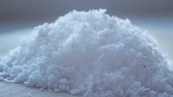 Coconut Flakes on white table — Stock Photo, Image