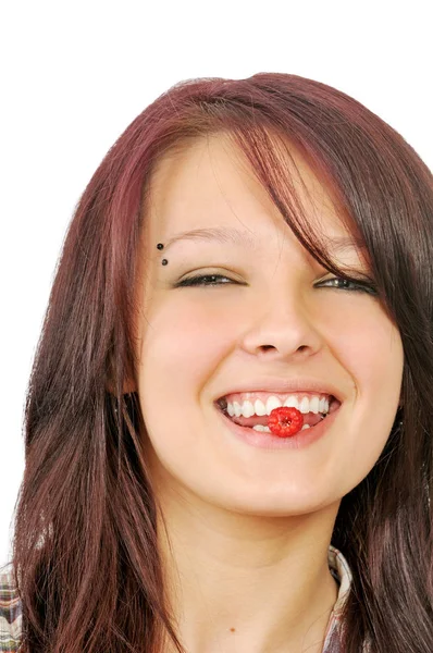 Smiling girl shows raspberry in mouth Royalty Free Stock Images
