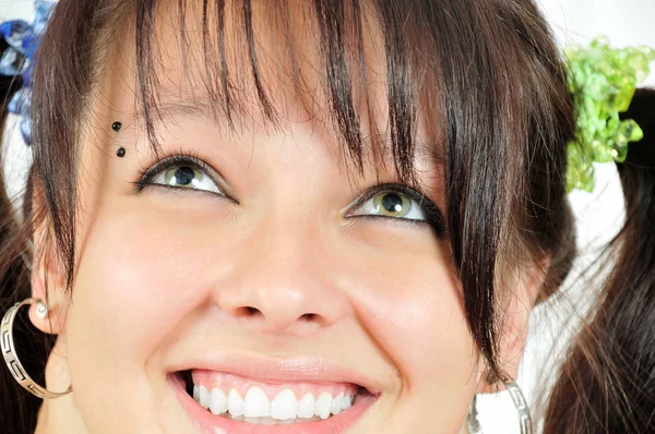 Closeup face of the smiling girl Stock Picture
