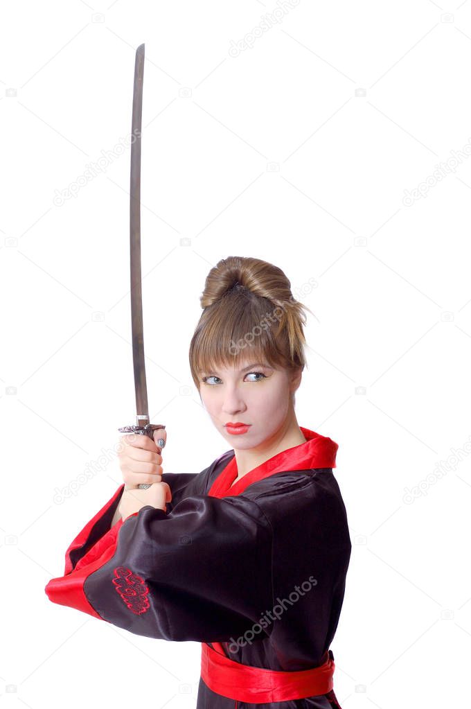 Beautiful girl in japan clothes with a katana sword