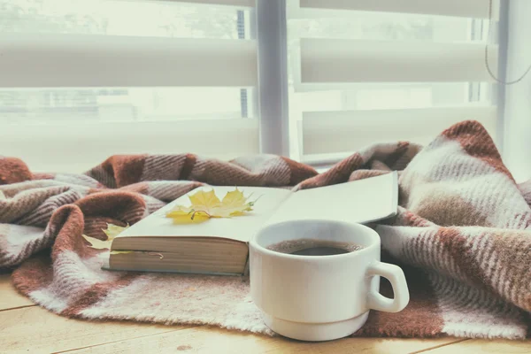 Cup of coffee and book with autumn yellow — Stock Photo, Image