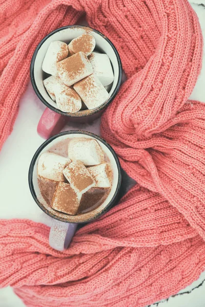 Hot chocolate with marshmallow in pink cups