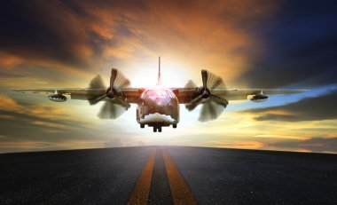 old military plane approaching to landing on airport runway clipart