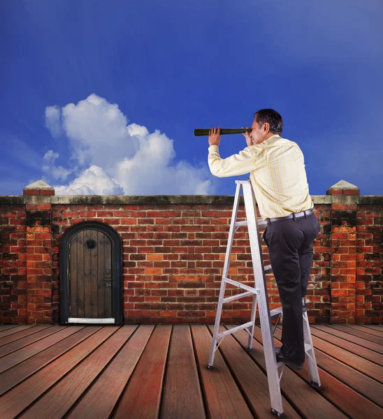 Business man and single spying telescope lens looking for target — Stock fotografie