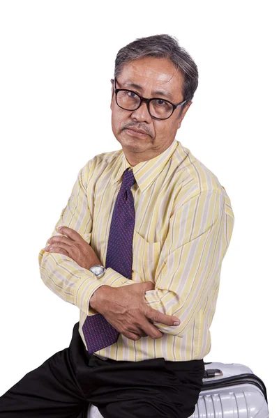 Head shot of asian business man sitting on traveling luggage wit — Stock Photo, Image