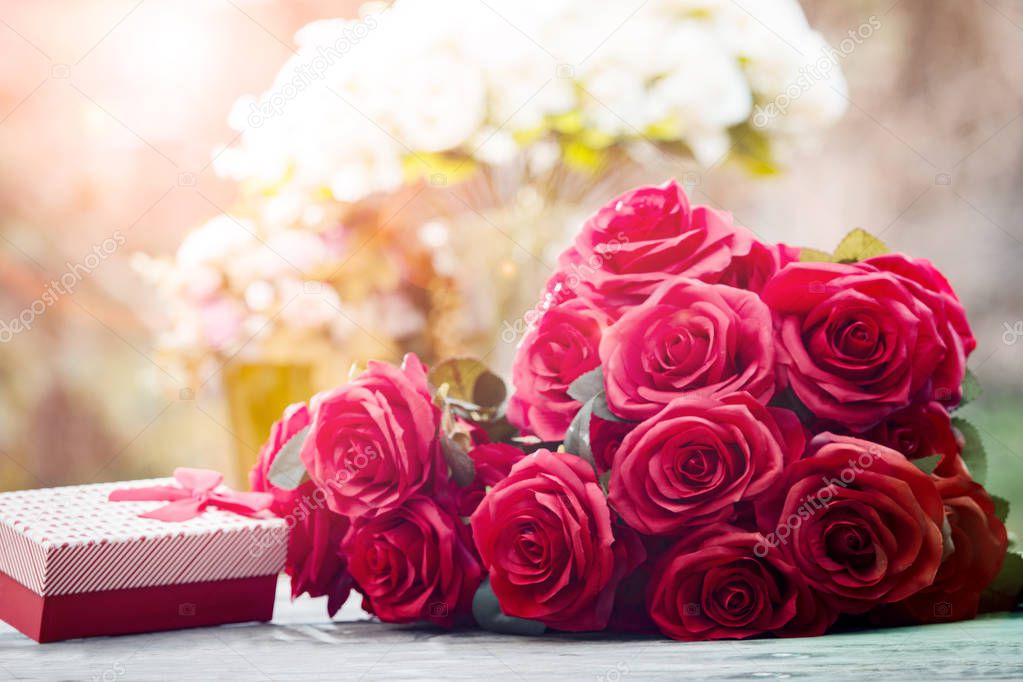 red roses flowers with valentine festival gift and beautiful blu