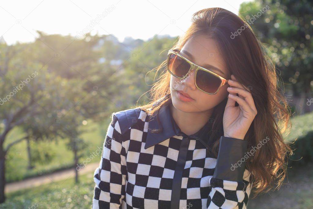 close up face of young beautiful  asian woman wearing sun glasse